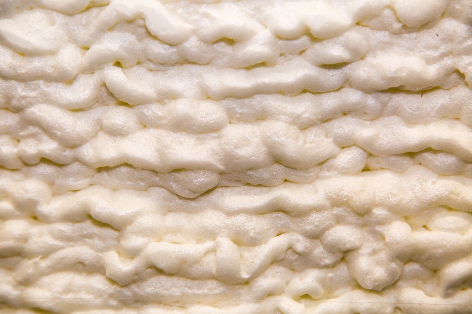 Up close image of open cell foam insulation.