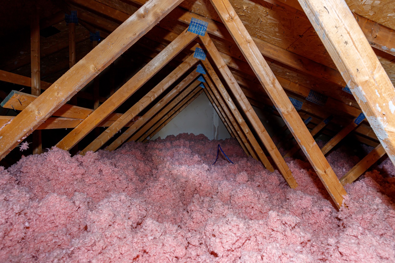 Fiberglass insulation in an attic.