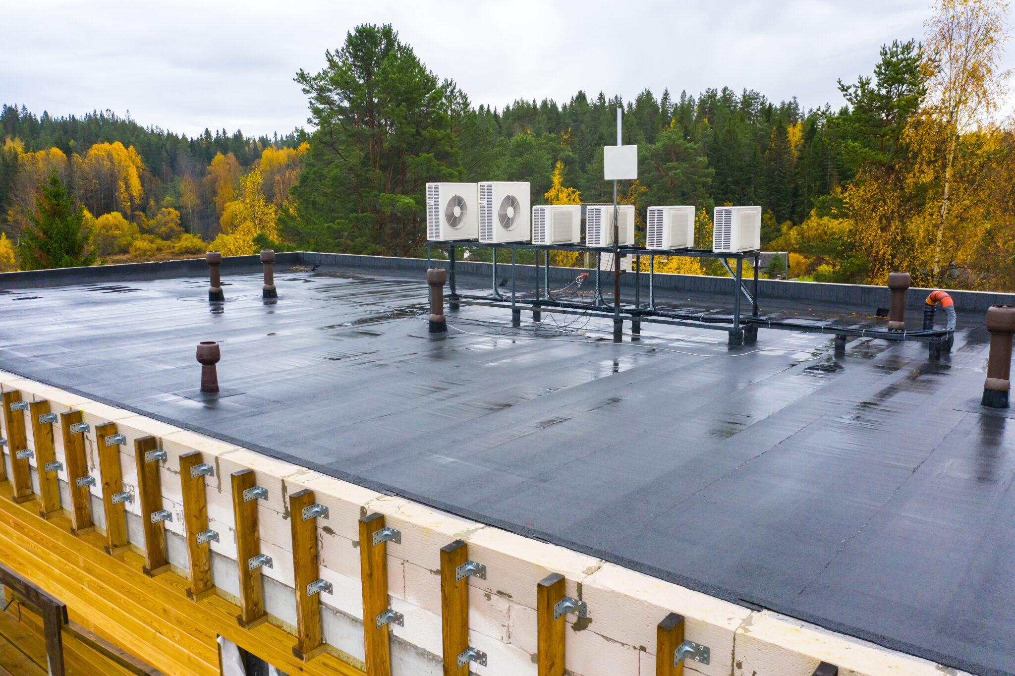 Industrial roof with AC units coated in modified bitumen.